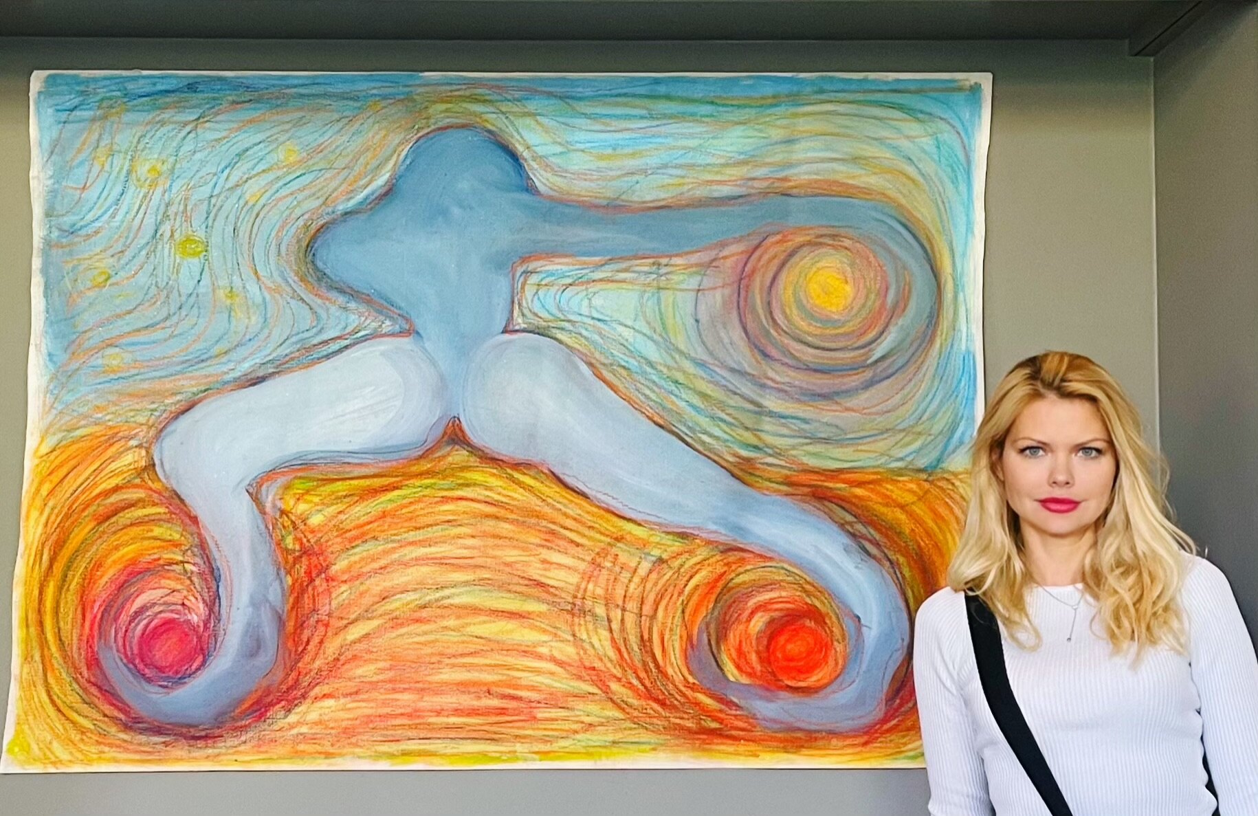Aleksandra Klitina beside an artwork at her Oslo exhibition